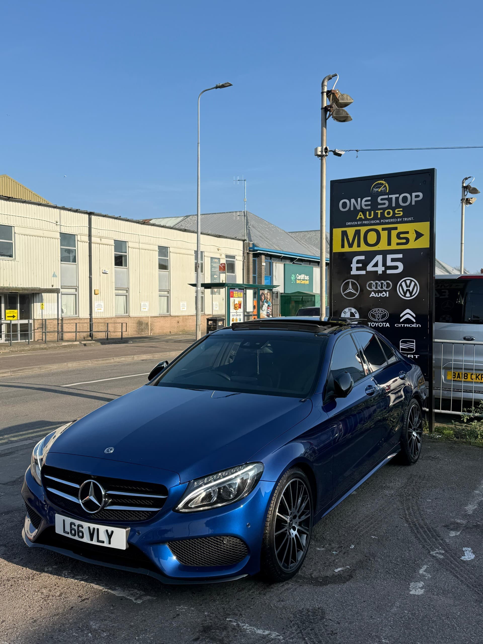 Mechanic inspecting vehicle